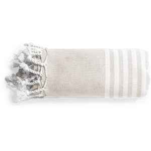 A folded beige towel pareo with white stripes and tassels, featuring a logo on the edge.