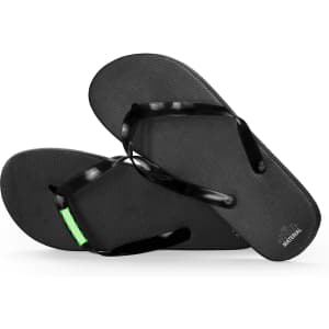 Black flip flops with green detailing and a textured footbed, featuring straps made of flexible material.