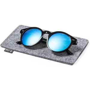 Sunglasses with black frames and blue mirrored lenses resting on a grey felt pouch, featuring a logo.