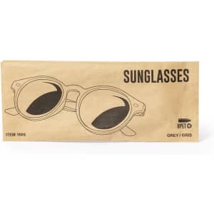 Sunglasses in a packaging featuring a grey design and a logo. The style is round with dark lenses.