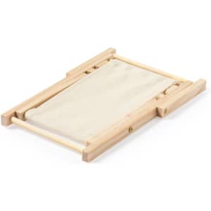 A wooden phone stand in light brown with a beige fabric base, featuring a simple, minimalist design.