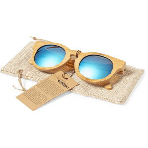 Bamboo sunglasses with blue mirrored lenses, resting on a textured beige pouch with a tag attached.
