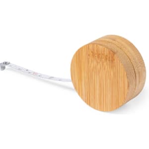 A round, bamboo tape measure with a retractable measuring tape. The tape is partially extended.