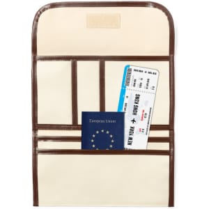A travel document holder in cream and brown, featuring slots for a passport and travel tickets.