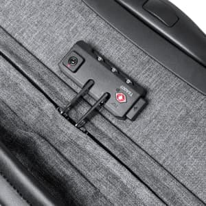A grey wheeled bag featuring a zipper and a small black device with buttons, likely for security.