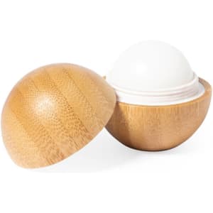 A bamboo container with a white lip balm inside, showcasing a natural and eco-friendly design.