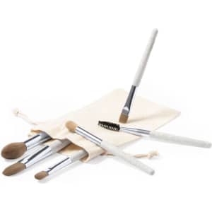A set of six eyeshadow applicators in a cream pouch, featuring soft bristles and silver accents.