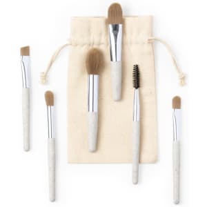 A set of six eyeshadow applicators with soft bristles and a cream pouch for storage.
