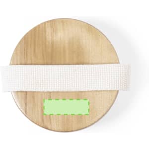 A round wooden base with a white exfoliating massage brush resting on top. The product has a branding logo.
