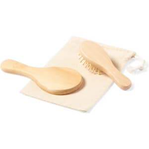 A wooden hairbrush set comprising a classic paddle brush and a smaller comb, presented in a fabric pouch.