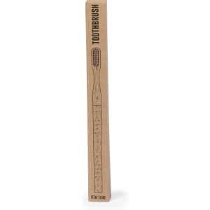A toothbrush in a cardboard packaging featuring a decorative design, predominantly light brown. It includes a logo.