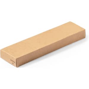 A rectangular, brown cardboard box labelled as a shaving kit set.