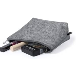 A grey toiletry bag with various beauty products peeking out, including lipsticks and a compact. Features a logo.