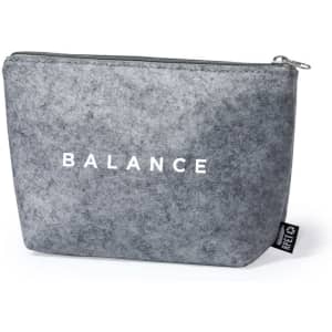 A grey toiletry bag with a zipper and a logo, featuring the word "BALANCE" prominently displayed.