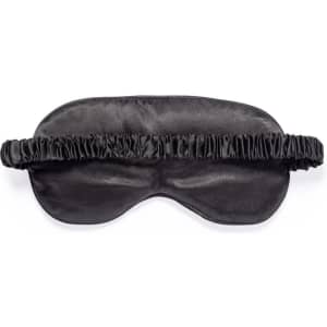 A black satin eye mask with a gathered elastic band for a comfortable fit. Features a simple design with no visible branding.