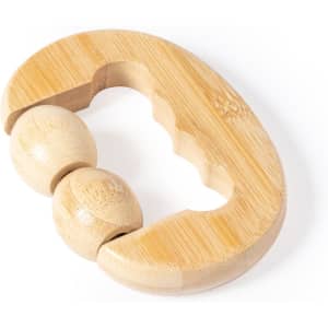 A wooden massager in a curved shape with two rolling balls. The design is natural and light in colour.