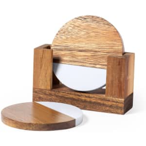 A wooden coaster set featuring circular coasters with a combination of light wood and white surfaces, neatly stored in a holder.