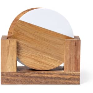 A coasters set featuring round wooden coasters with a white and natural wood design, held in a wooden holder.
