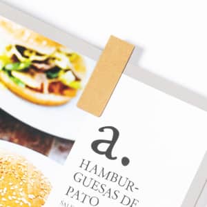 A brown Jofry Bookmark is attached to a printed menu featuring images of gourmet burgers.