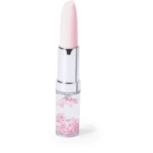 A pink lipstick with a glossy finish, featuring decorative floral elements in the base.