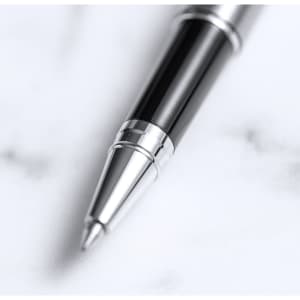 A sleek metal pen in black and silver with a polished finish, featuring a silver tip and accents.