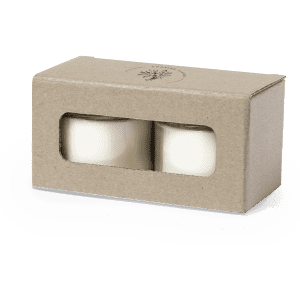 A candle set in a cardboard box with a window, featuring two white candles.