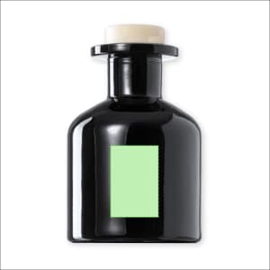 A black aromatic diffuser bottle with a green label and a white top, featuring a circular opening.