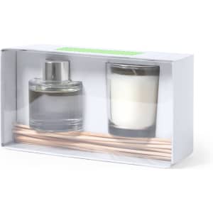 A scented candle and a diffuser set in clear glass containers, accompanied by wooden sticks, presented in a gift box.