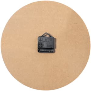 A round, plain cardboard backing with a black clock mechanism fixed in the centre.