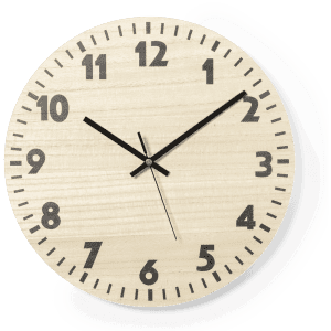 A wall clock with a light wood finish, black numbers, and hands, displaying a simple and modern design.
