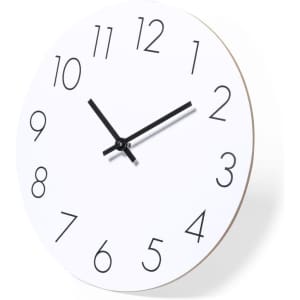 A round white wall clock with bold black numerals and black hands, featuring a minimalist design.