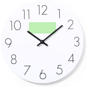 A wall clock featuring a white face, bold black numbers, and black hands, with a green rectangular accent.
