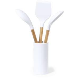 A kitchen set featuring three white cooking utensils with bamboo handles, displayed in a white holder.