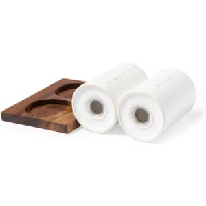 A wooden holder with two white kitchen rolls, designed for convenient storage.