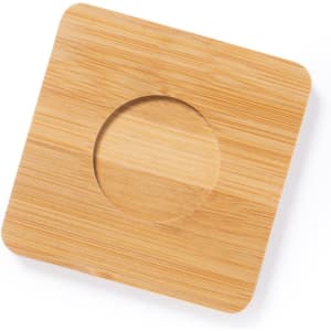 A bamboo coaster featuring a circular indent in the centre. The surface is smooth and natural in colour.