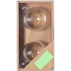 A set of two clear glass mugs in a cardboard packaging with a logo visible on the box.