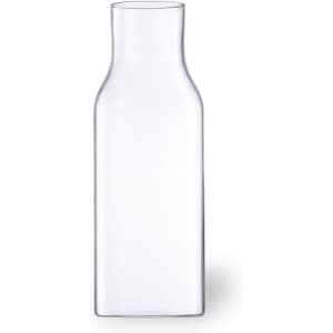 A clear glass drink bottle with a slender neck and a rectangular base. Features a logo.