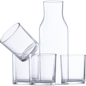 A clear glass drink bottle with four matching tumblers, showcasing a sleek design.