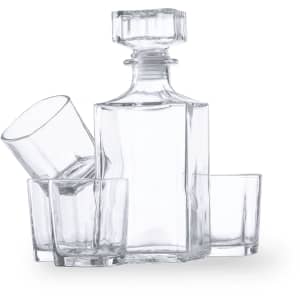 A clear glass whisky decanter set with a rectangular bottle and four accompanying tumblers.