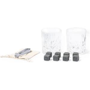 A whisky set featuring two crystal glasses, four cooling stones, and a storage pouch, with a silver bottle opener.