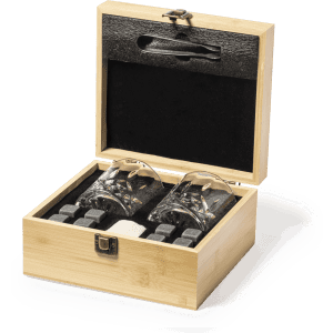 A bamboo box containing two glass tumblers and four whisky stones. The interior is dark with a velvet lining.