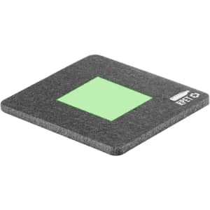 A grey coaster with a green centre, featuring a logo on one side.
