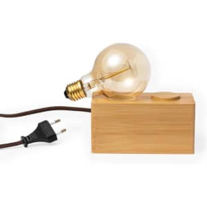 A bamboo lamp base with a vintage bulb and a power cord, featuring a simple design.