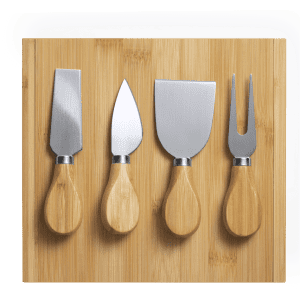 A bamboo cheese board featuring four stainless steel cheese knives with wooden handles.