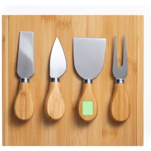 A bamboo cheese board featuring four stainless steel cheese knives with wooden handles.