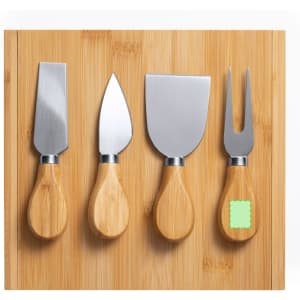 A bamboo board featuring four cheese knives with wooden handles. The knives have stainless steel blades.