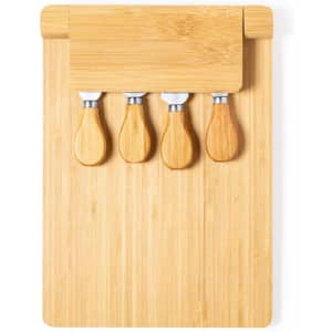 A bamboo cheese board with four stainless steel cheese knives featuring wooden handles.