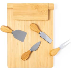 A bamboo cheese board with four stainless steel knives featuring wooden handles, arranged neatly atop the board.