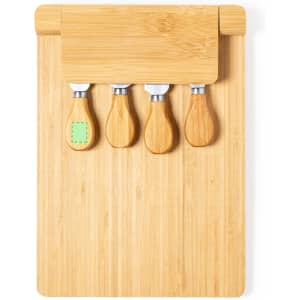 A bamboo cheese board with four stainless steel cheese knives, each featuring a wooden handle.