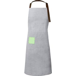 A grey apron with a brown strap and a small green patch on the front. It features a logo on the patch.
